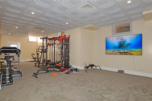 exercise room featuring carpet flooring, recessed lighting, and baseboards