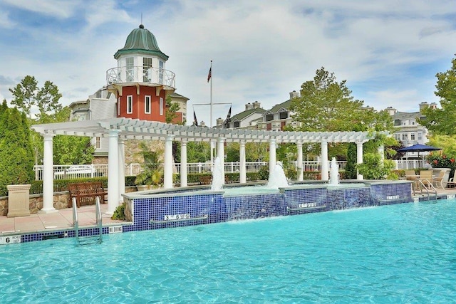 view of swimming pool featuring a pergola