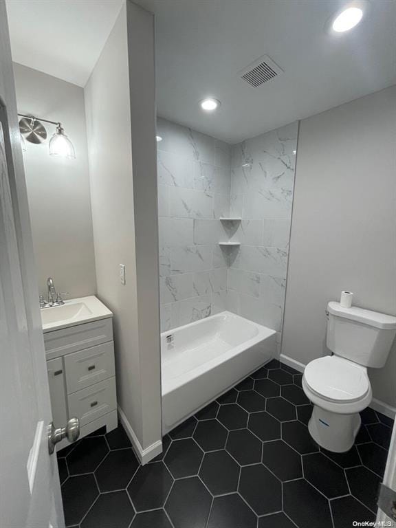 bathroom with visible vents, toilet, recessed lighting, baseboards, and vanity