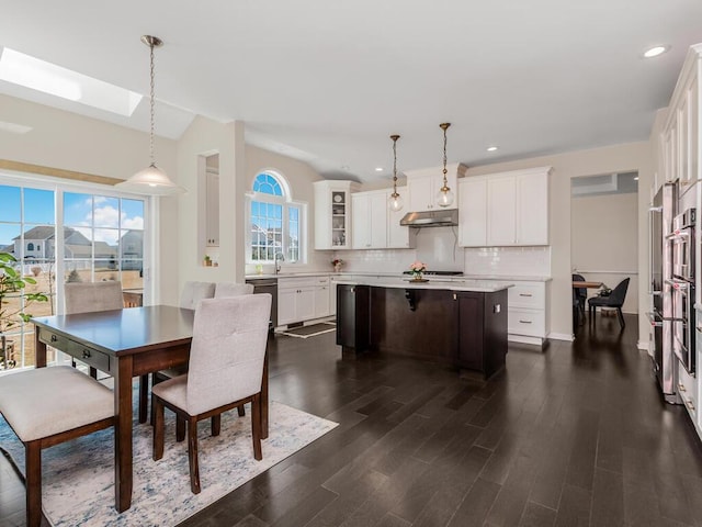 dining room featuring recessed lighting, dark wood-type flooring, and lofted ceiling