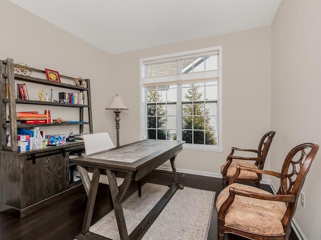 office area featuring dark wood finished floors and baseboards