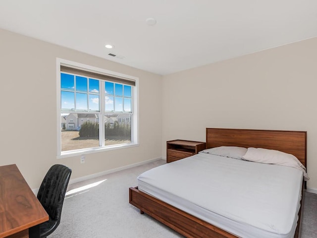 bedroom with recessed lighting, visible vents, baseboards, and carpet