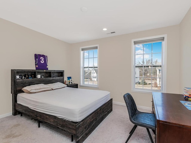 bedroom with recessed lighting, visible vents, baseboards, and light carpet