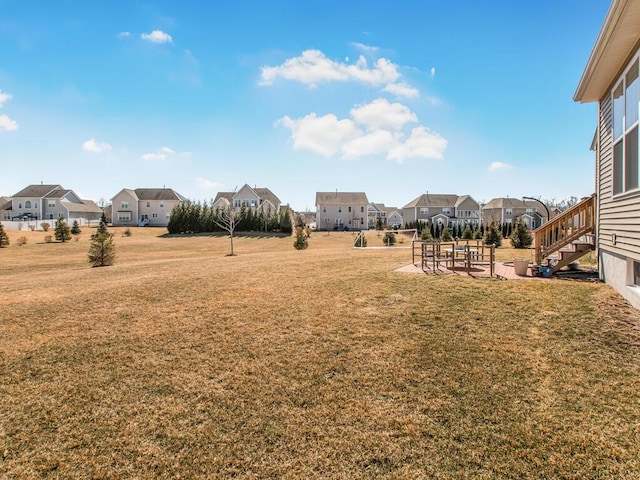 view of yard with a patio and a residential view