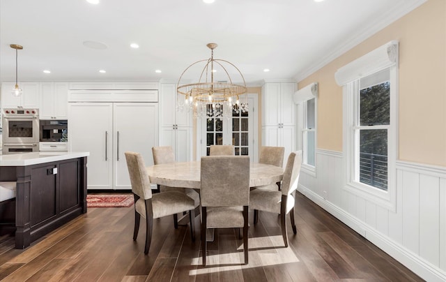 dining room with recessed lighting, ornamental molding, dark wood-type flooring, wainscoting, and a chandelier