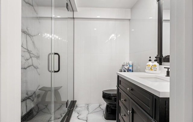 bathroom featuring a marble finish shower, toilet, marble finish floor, and vanity