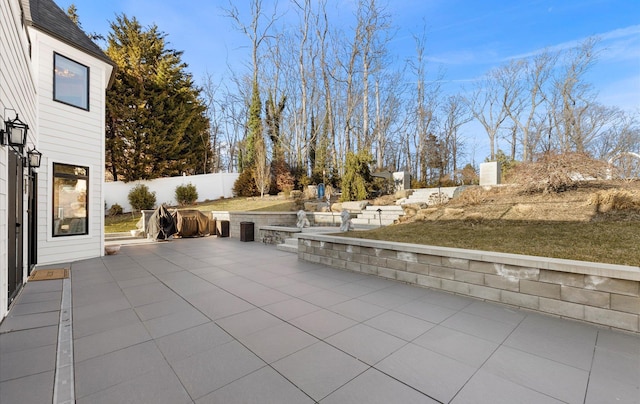 view of patio / terrace featuring fence