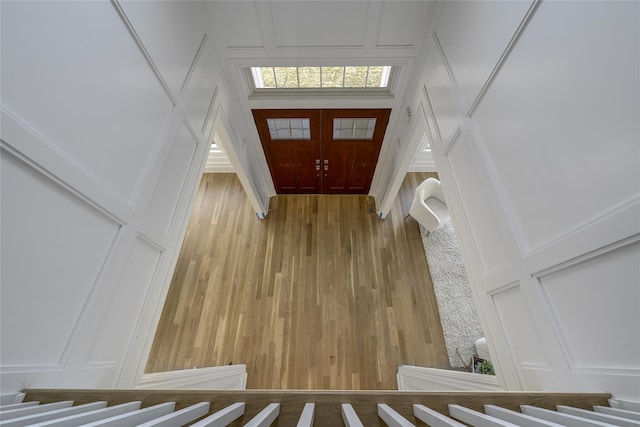 foyer with a decorative wall and wood finished floors