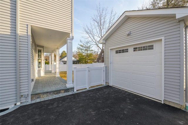 garage featuring fence