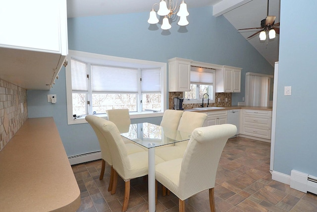 dining area with beamed ceiling, high vaulted ceiling, a baseboard heating unit, stone finish flooring, and a baseboard radiator