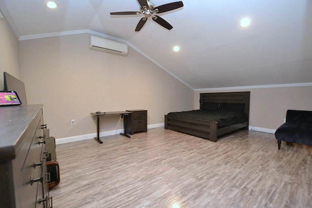 bedroom with vaulted ceiling, light wood-style floors, a wall mounted air conditioner, and ornamental molding