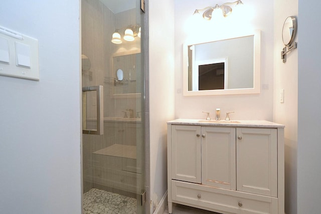 full bathroom with a stall shower and vanity