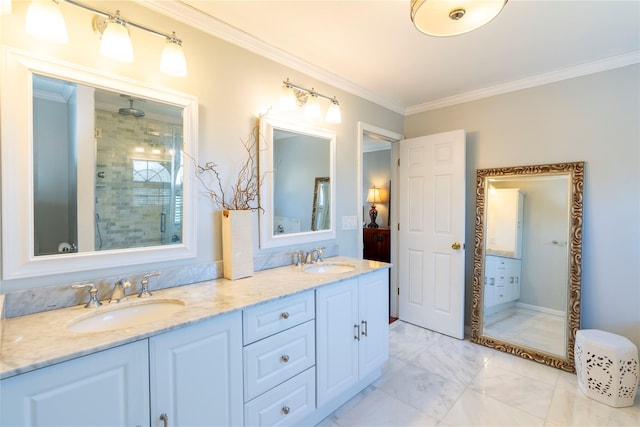 full bath featuring double vanity, a shower stall, crown molding, and a sink