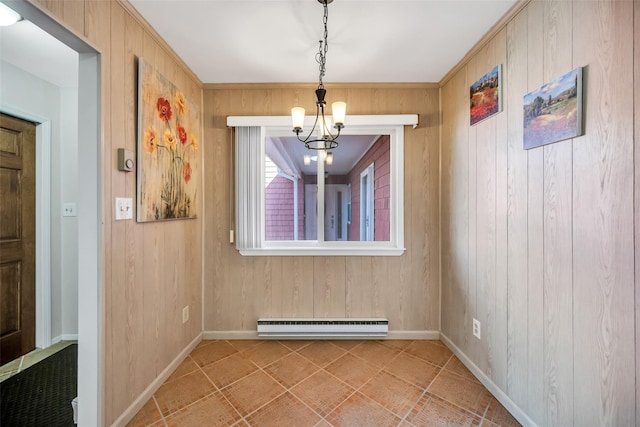 unfurnished dining area featuring an inviting chandelier, wooden walls, baseboards, and a baseboard radiator