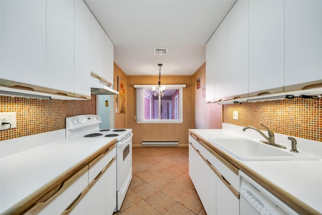 kitchen featuring a sink, under cabinet range hood, white appliances, light countertops, and a baseboard radiator