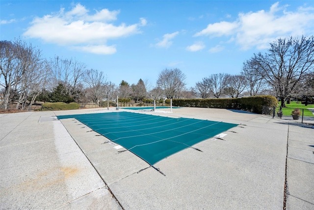 view of swimming pool with a patio area