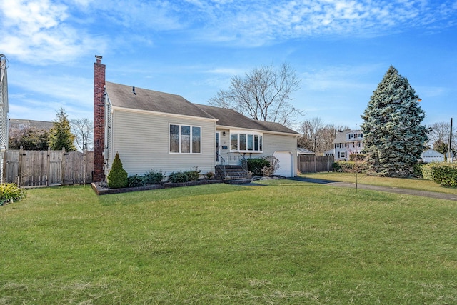 ranch-style house with a front yard, fence, driveway, an attached garage, and a chimney