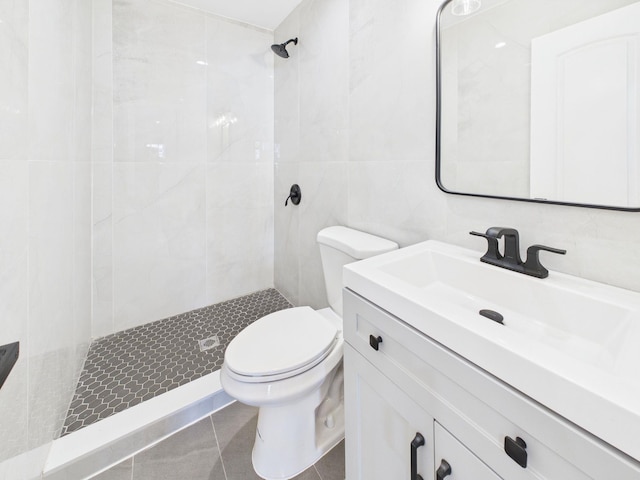 full bath featuring tile walls, toilet, and a stall shower