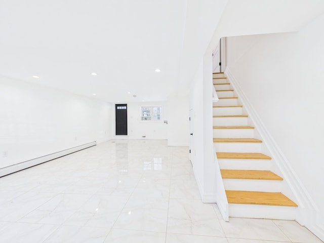 stairway featuring recessed lighting, marble finish floor, and a baseboard heating unit