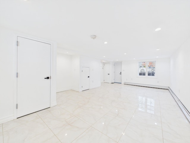 empty room featuring a baseboard heating unit, recessed lighting, baseboards, and baseboard heating