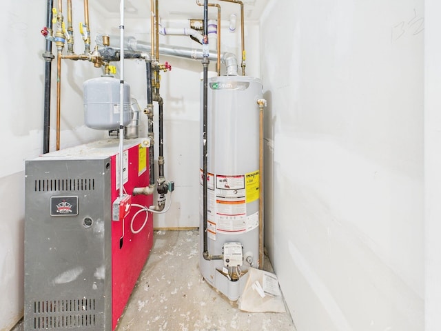 utility room featuring water heater and a heating unit