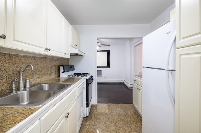 kitchen featuring under cabinet range hood, a sink, backsplash, granite finish floor, and white appliances