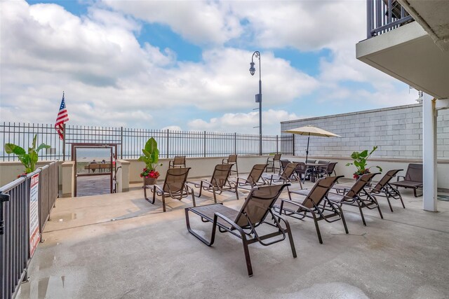 view of patio featuring fence