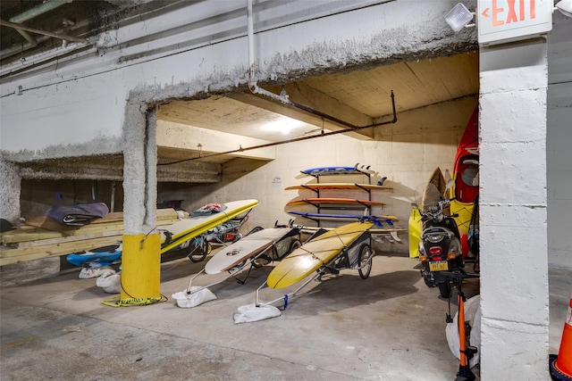 below grade area featuring concrete block wall