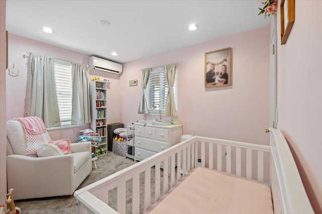 bedroom with recessed lighting, multiple windows, an AC wall unit, and a crib