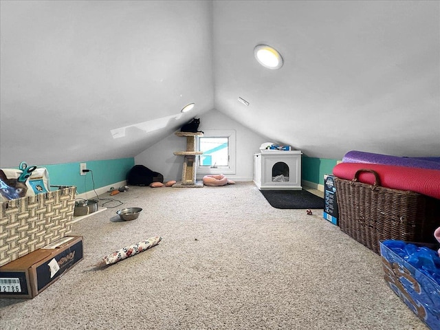 additional living space with baseboards and lofted ceiling with skylight