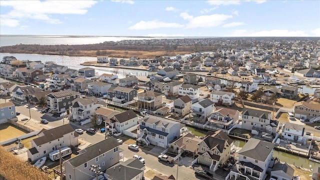 birds eye view of property featuring a residential view and a water view