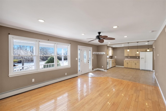 unfurnished living room with a ceiling fan, recessed lighting, light wood finished floors, a baseboard radiator, and baseboards