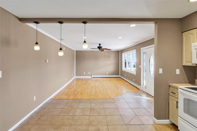 kitchen with white appliances, pendant lighting, light tile patterned flooring, and a ceiling fan