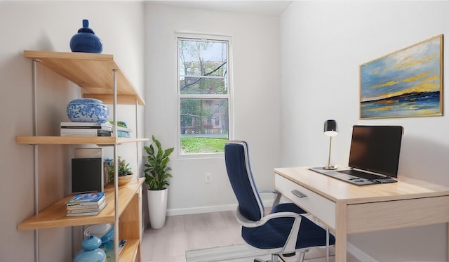 home office with wood finished floors and baseboards