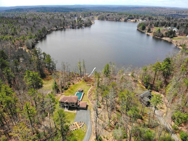 aerial view with a forest view and a water view