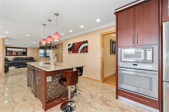 kitchen featuring crown molding, light stone countertops, a kitchen breakfast bar, hanging light fixtures, and stainless steel appliances