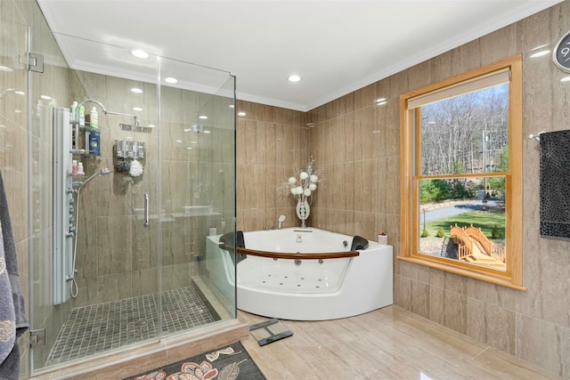 full bath featuring a shower stall, tile walls, ornamental molding, and a whirlpool tub