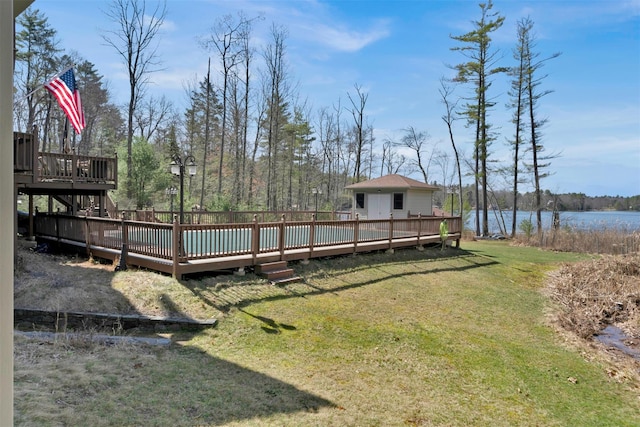 view of yard featuring a deck with water view