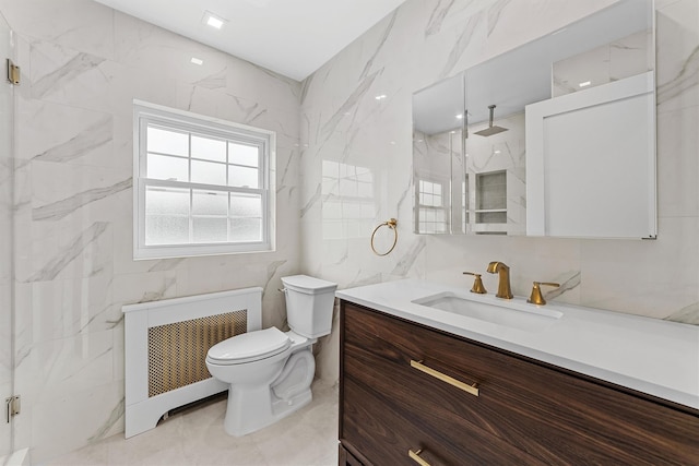 bathroom featuring a marble finish shower, tile walls, toilet, radiator heating unit, and vanity