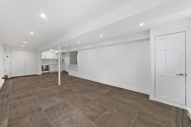 finished below grade area featuring recessed lighting and baseboards