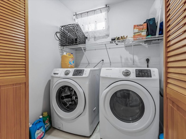 laundry area featuring washing machine and dryer and laundry area