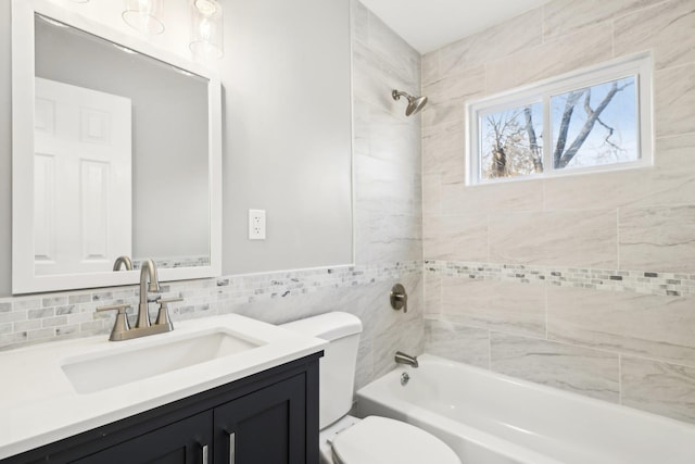 bathroom with vanity, toilet, and shower / bathtub combination