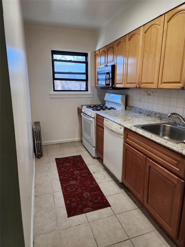 kitchen with gas stove, a sink, decorative backsplash, black microwave, and dishwasher