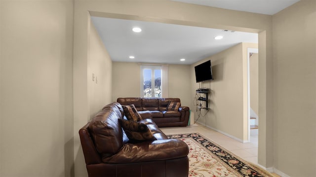 living room with light tile patterned floors, baseboards, and recessed lighting