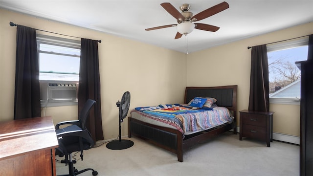 carpeted bedroom with cooling unit, a ceiling fan, baseboards, and a baseboard radiator