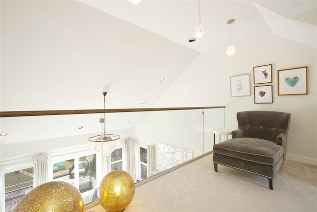 sitting room with baseboards, carpet flooring, and vaulted ceiling