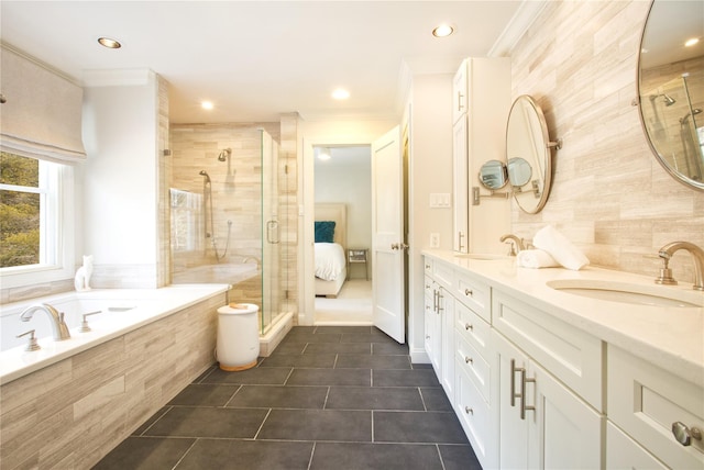 ensuite bathroom with a stall shower, a sink, crown molding, tile patterned flooring, and a bath