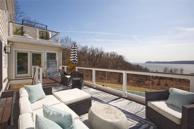 wooden deck featuring outdoor lounge area