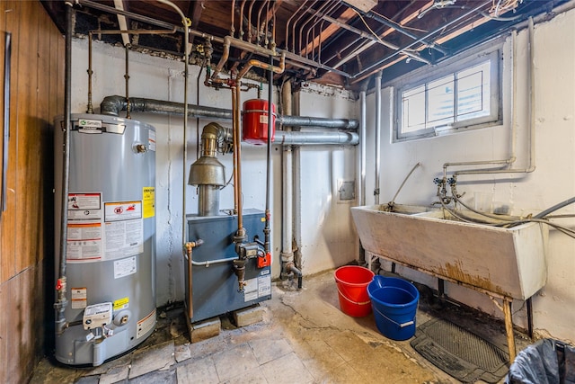 utilities with water heater, a heating unit, and a sink