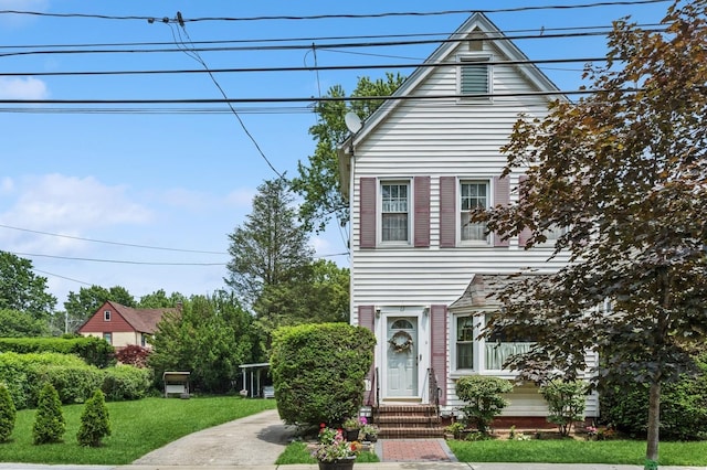 73 Spruce Ave, Floral Park, NY 11001 - view of front of home with a front lawn